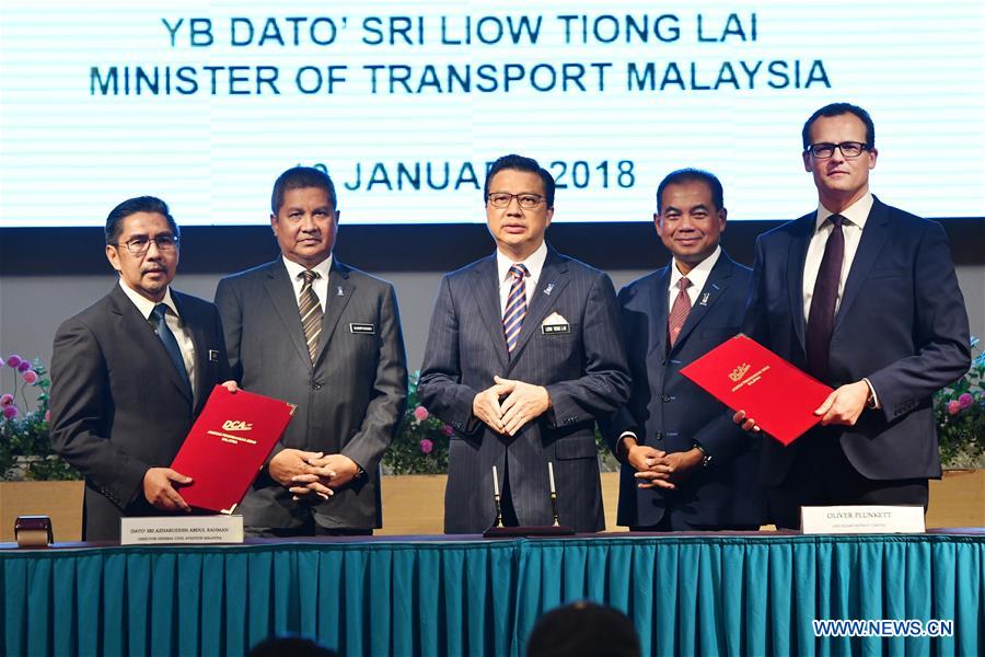 MALAYSIA-PUTRAJAYA-MH370-SEARCH OPERATIONS-SIGNING CEREMONY